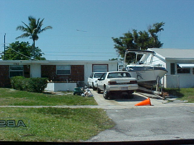 Photo of an Inoperable Motor Vehicle in Driveway